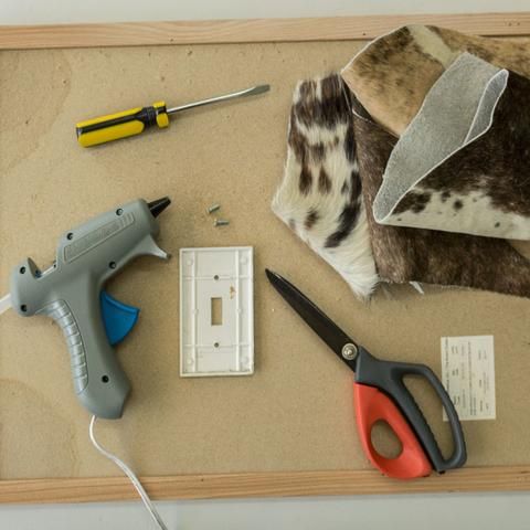 some tools are laying out on top of a board with paper and glue to make it look like they have been cut