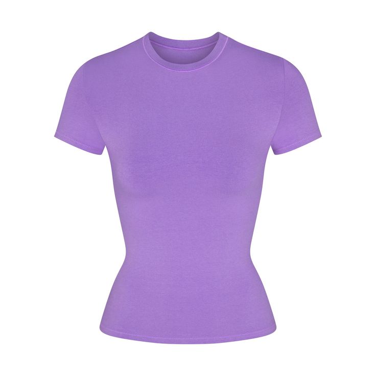 Our viral t-shirt in the cotton everyone craves. This perfect five-star tee is made with our stretchy, lightweight cotton that enhances your curves with its body-hugging fit and elevates your comfort with its incredibly soft feel. Features stitching details along the short sleeves and hem and hits below the natural waist. Fits true to size. Pink And Purple Clothes, Basic Top Outfit, Purple Shirt Outfits, Purple Top Outfit, Purple Shirts, Purple Clothes, Purple Tops, Preppy Clothes, T Shorts