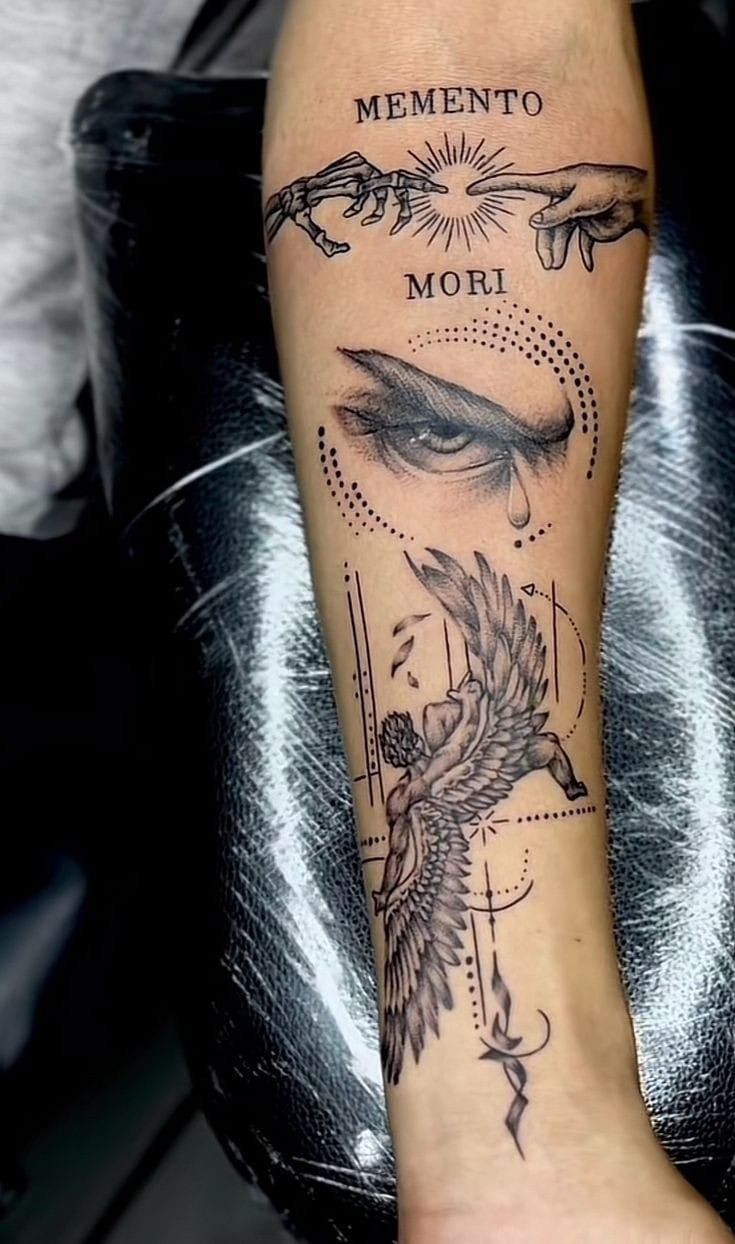 a woman's leg with tattoos on it and the words mementoo mori