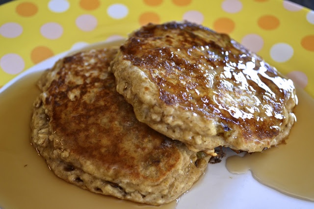 two pancakes sitting on top of a white plate