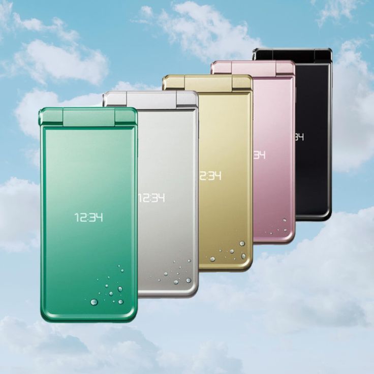 four different colored phones in the sky with water droplets on them and one is open