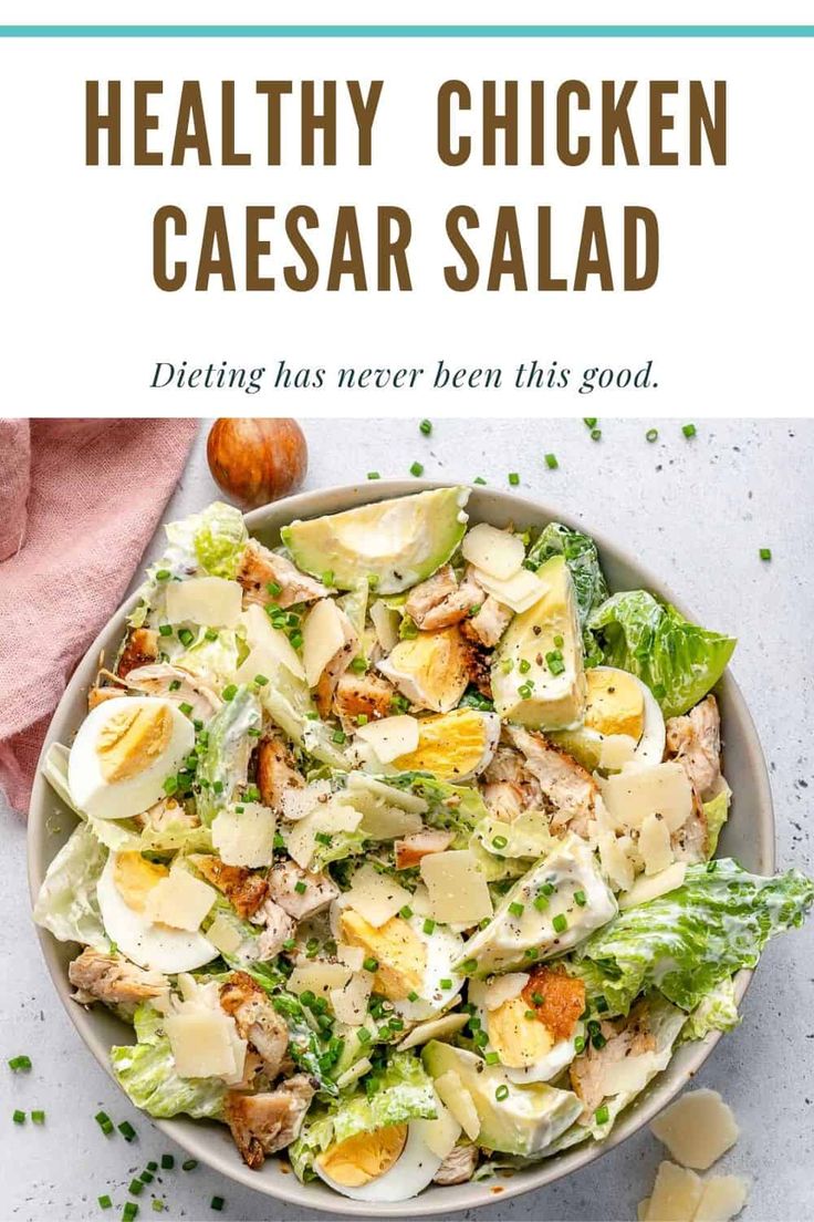 healthy chicken caesar salad in a white bowl with text overlay