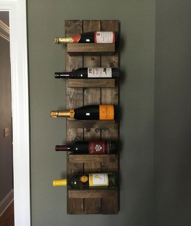 a wine rack made out of wooden pallets