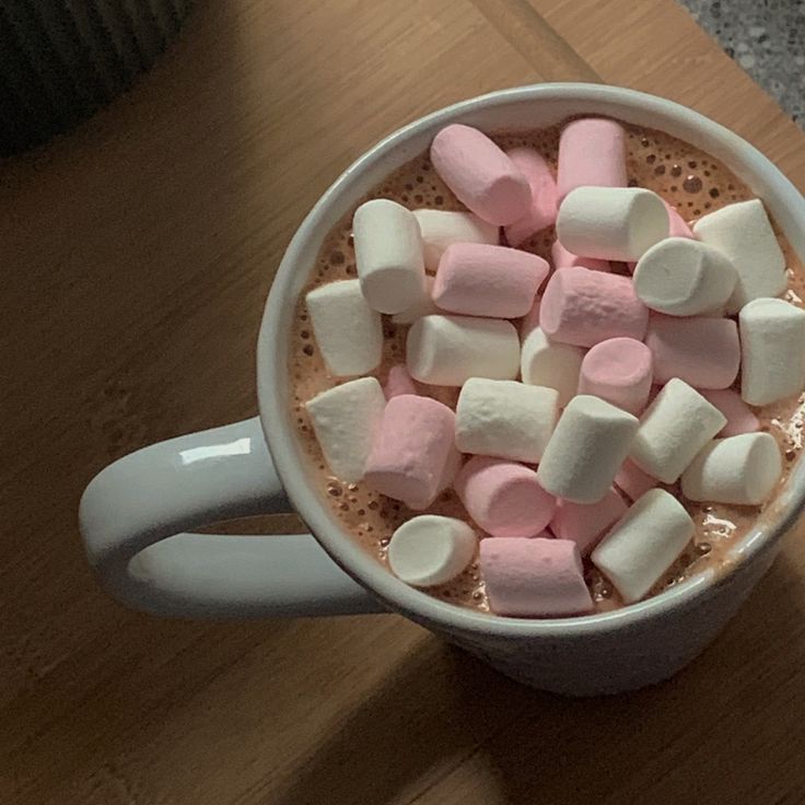 marshmallows in a mug on a table