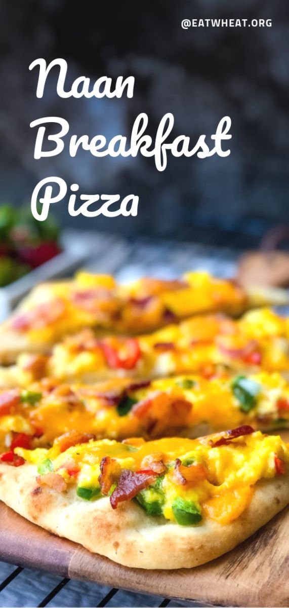 a close up of a pizza on a wooden cutting board with the words naan breakfast pizza