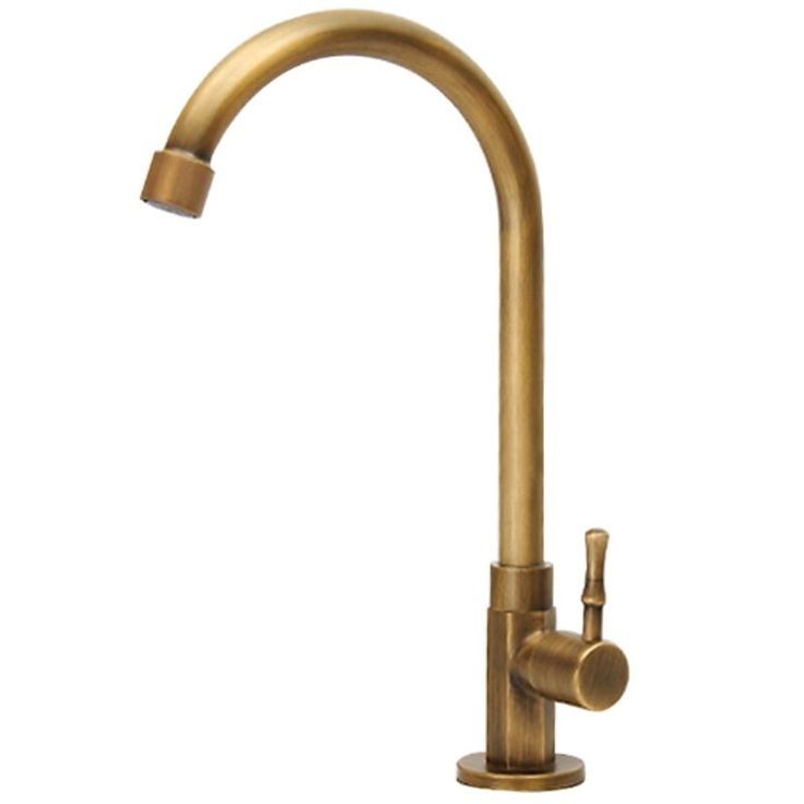 an antique brass faucet with two handles and nozzles on the side