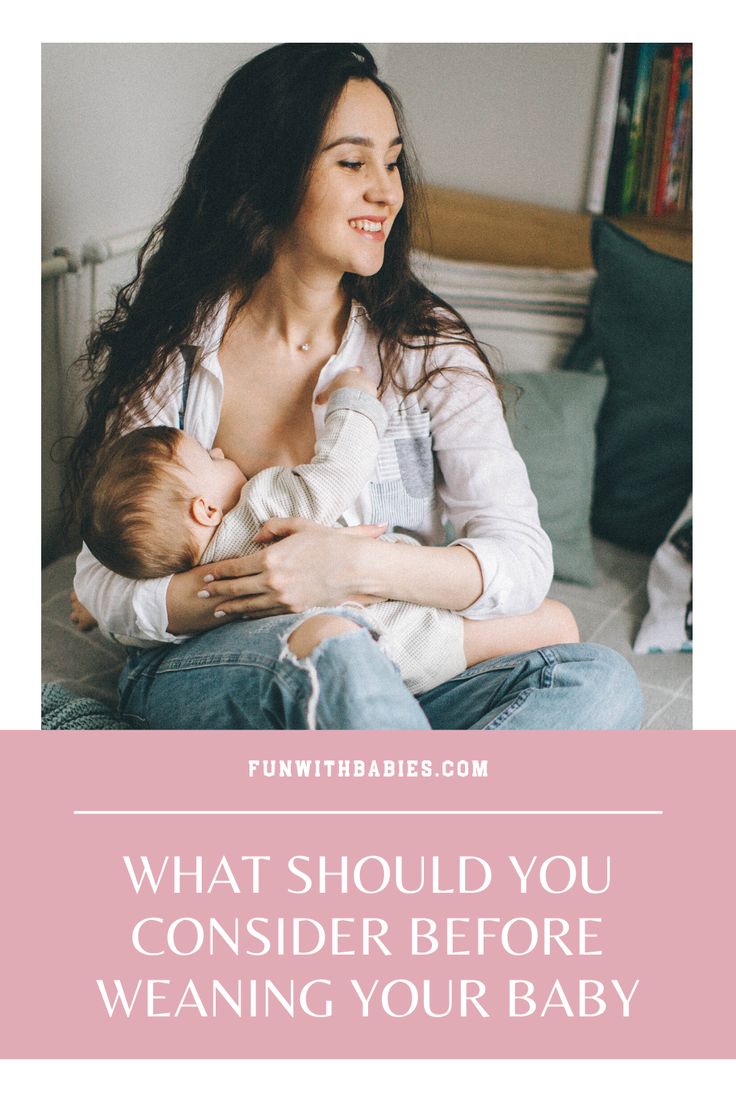 a woman holding a baby in her arms with the caption what should you consider before wearing your baby?