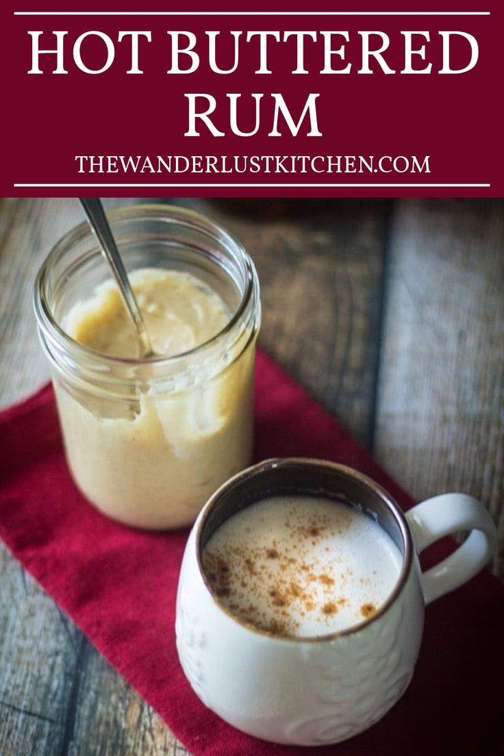 hot buttered rum in a glass jar next to a cup of coffee on a red napkin