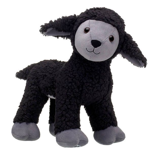 a black and white stuffed animal on a white background with the head turned to look like a lamb