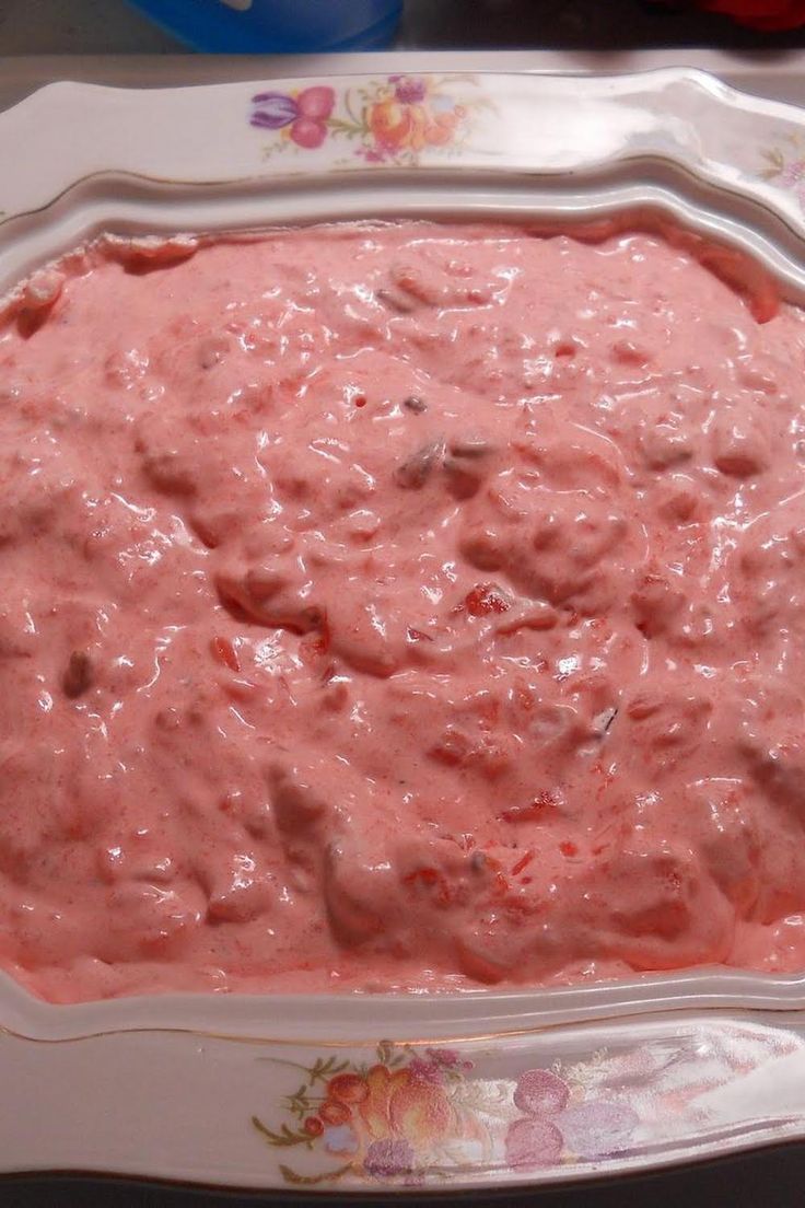 a pink dip in a white tray on a table