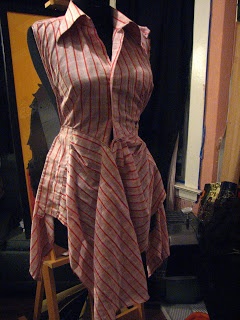 a mannequin wearing a pink and white striped dress