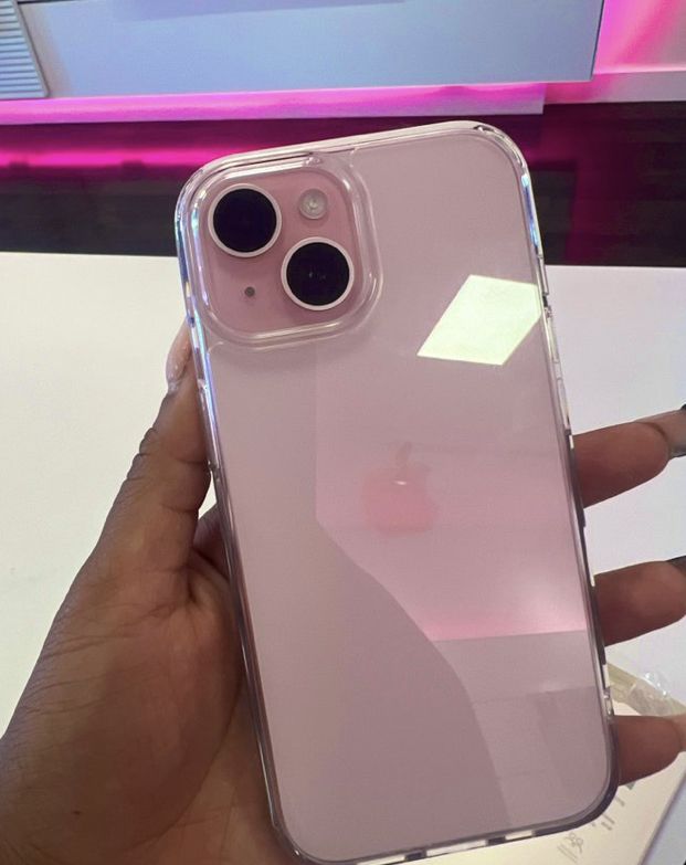 a person holding an iphone in their hand with the back cover partially covered by clear plastic