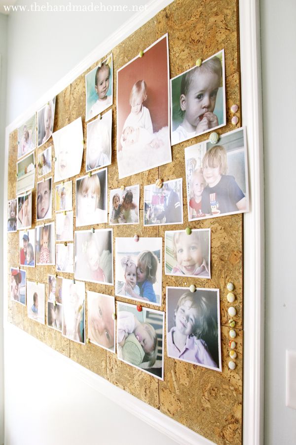 a cork board with pictures on it and beads hanging from the wall next to them