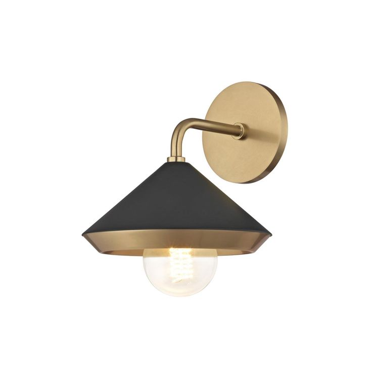 a brass and black wall light with an open bulb on the side, against a white background