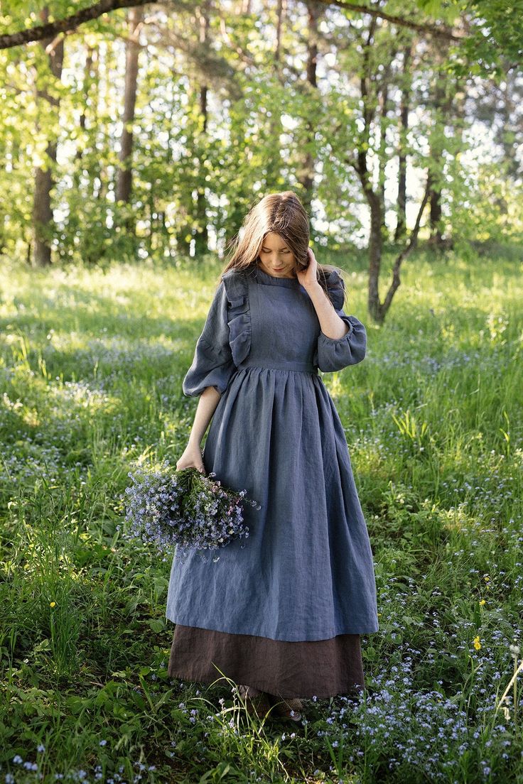 Victorian style apron with flutter sleeves is made from 100% soft and washed linen. Details: - Composition: 100% Oeko-Tex certified linen - Colour: dusty blue - Cross back - Length - 124 cm (49 inches) - Adjustable with buttons - Size: One size - Light weight linen - Linen care: machine wash gentle; tumble dry low, ironing optional - The price is for one pinafore dress, other pictured items are not included Measurements: Length from waist down: 80 cm (31,4 in) Chest width: 24 cm (9,4 in) without Linen Pinafore Apron, Farm Dress, Linen Pinafore, Apron For Women, Pinafore Apron, Vintage Apron, Cottagecore Outfits, Cottagecore Fashion, Aprons Vintage