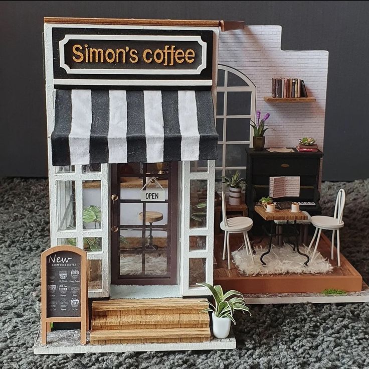 a miniature model of a coffee shop on the floor