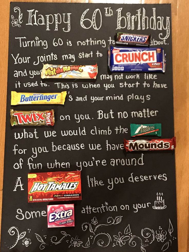 a blackboard with candy and writing on it that says happy 60th birthday to you