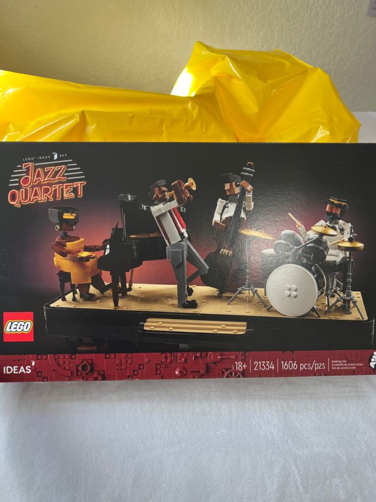 the box is open to show an image of some musical instruments and people on stage