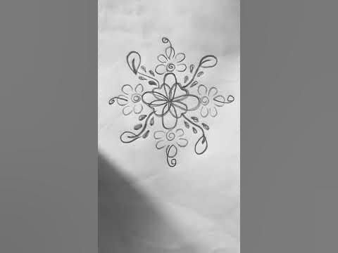 a black and white photo of a snowflake