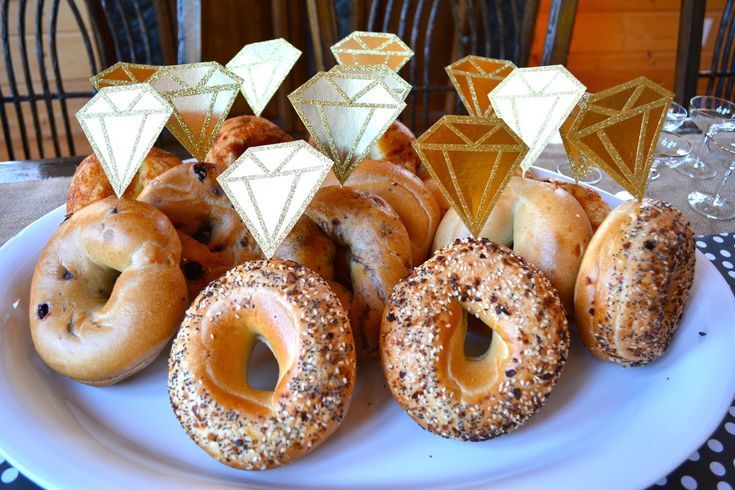 a white plate topped with donuts covered in sugar and diamond shapes on top of each other