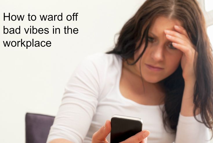 a woman sitting at a table with her cell phone in front of her, and the text how to ward off bad videos in the workplace