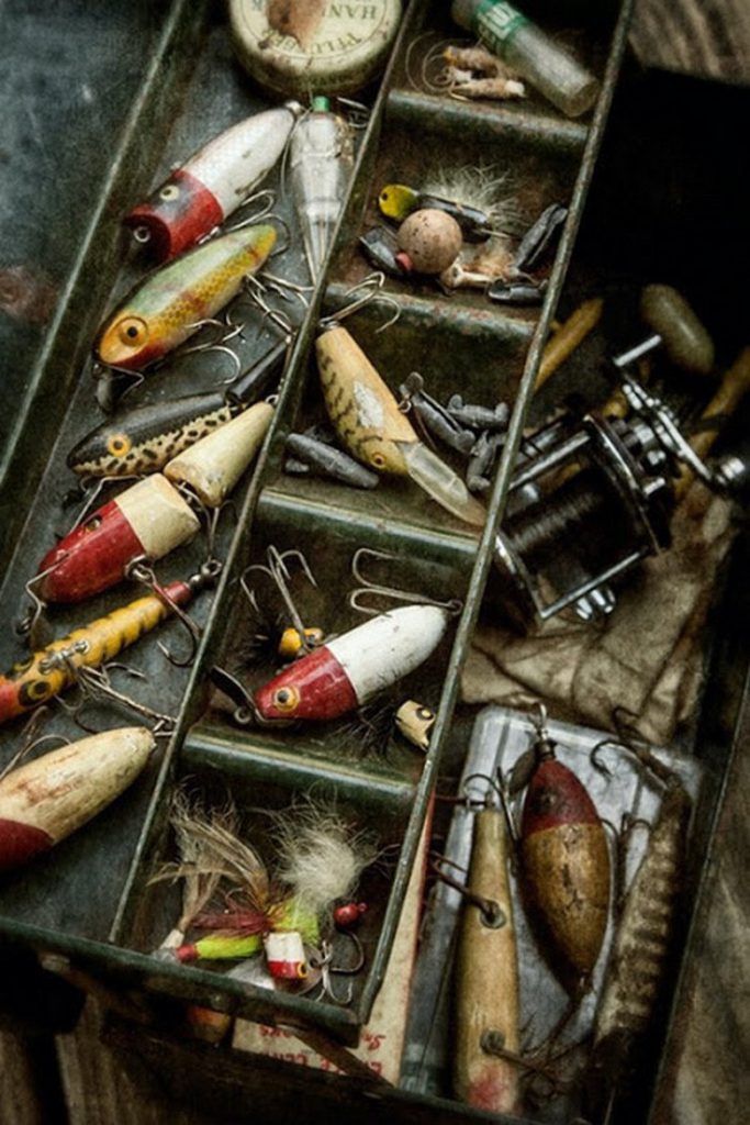 an assortment of fishing lures in a box