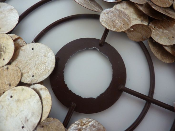 a circular metal object surrounded by wood slices