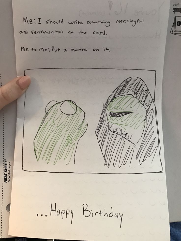 someone is holding up a birthday card for their child's drawing on the paper