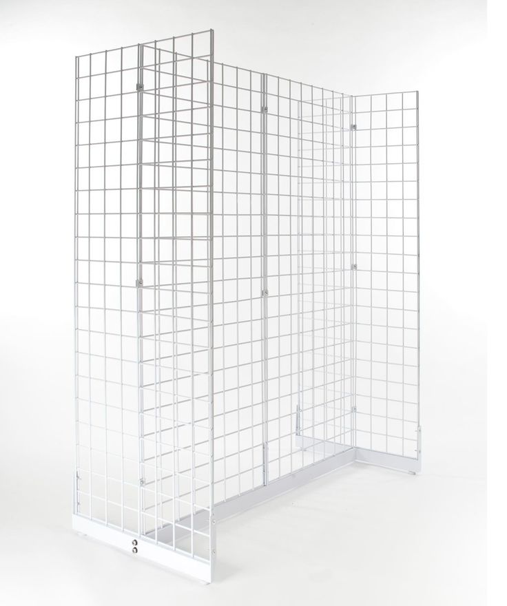 a white room divider with metal grids on the sides