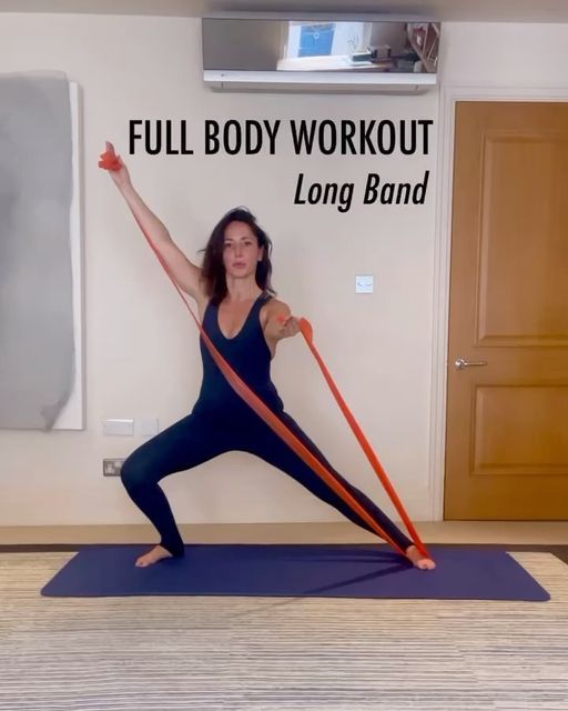 a woman is doing yoga with an exercise band