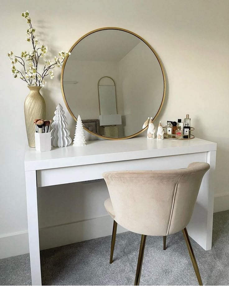 a white desk with a round mirror on it