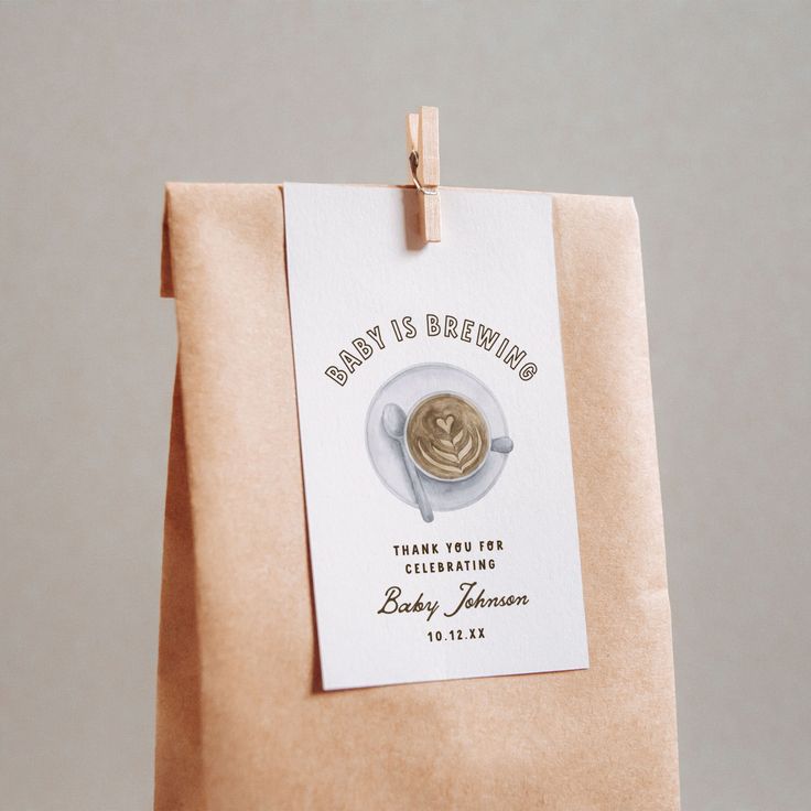 a brown paper bag with a tag on it that says, baby is brewing