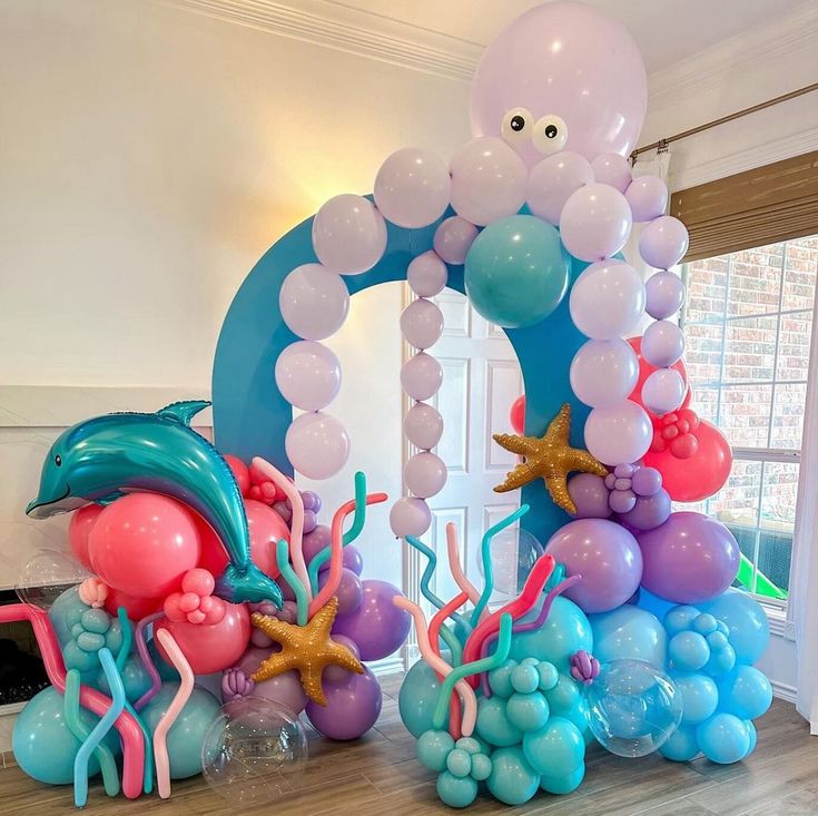 an ocean themed birthday party with balloons and decorations