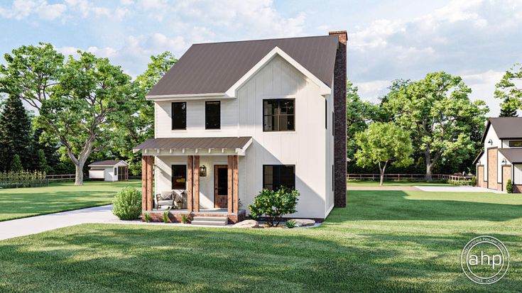 a white house sitting on top of a lush green field