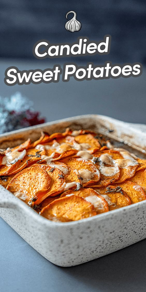 a white dish filled with sweet potatoes on top of a table