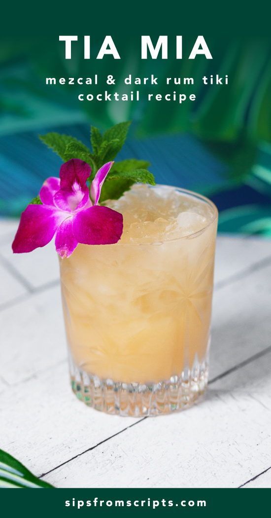 a cocktail with a flower on the rim and text that reads tia mia mezcal & dark rum tiki cocktail recipe