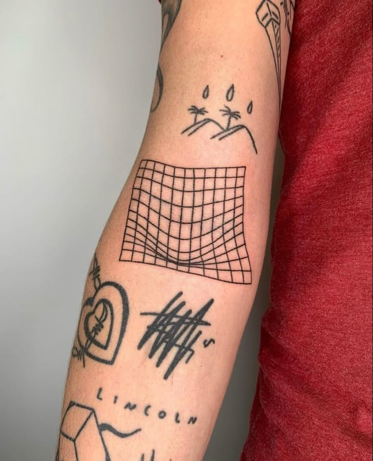 a man's arm with tattoos on it, including lines and shapes in black ink