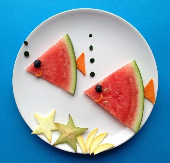 a white plate topped with slices of watermelon