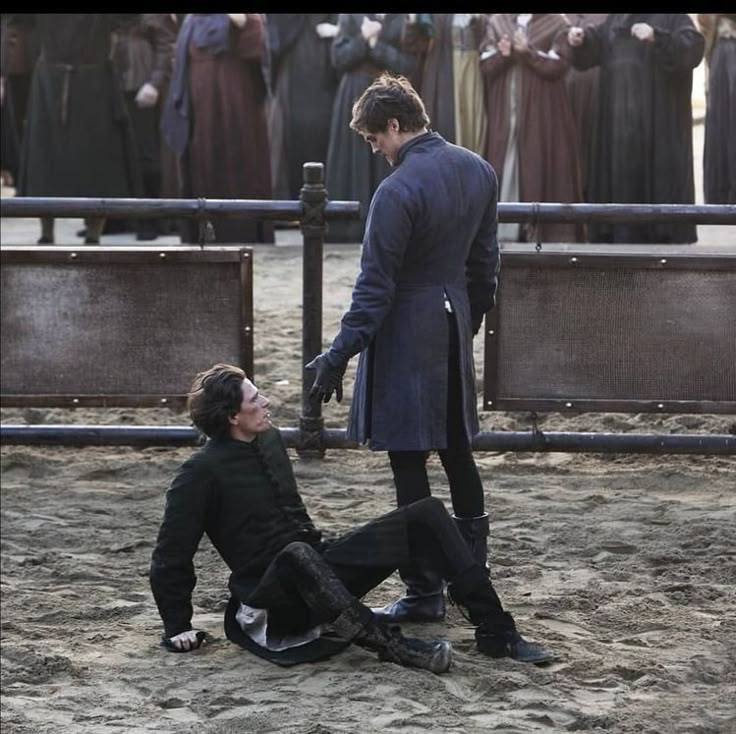 a man is being held by another man on the ground