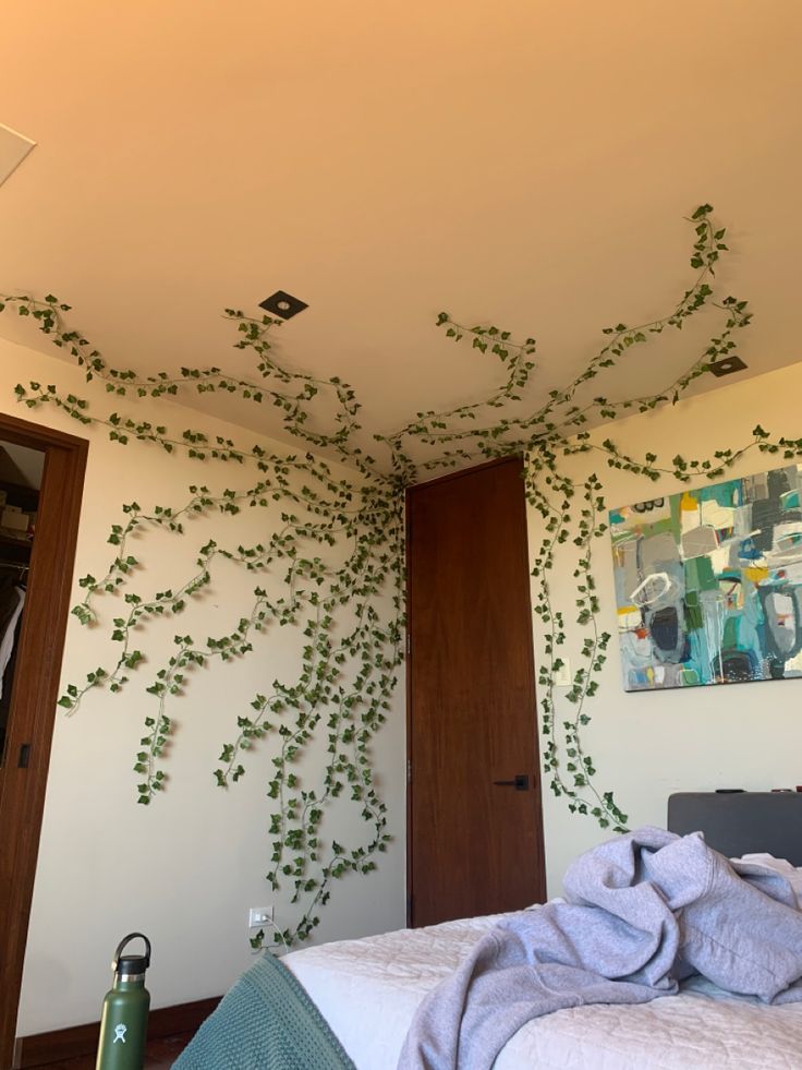 a bedroom with vines growing on the wall