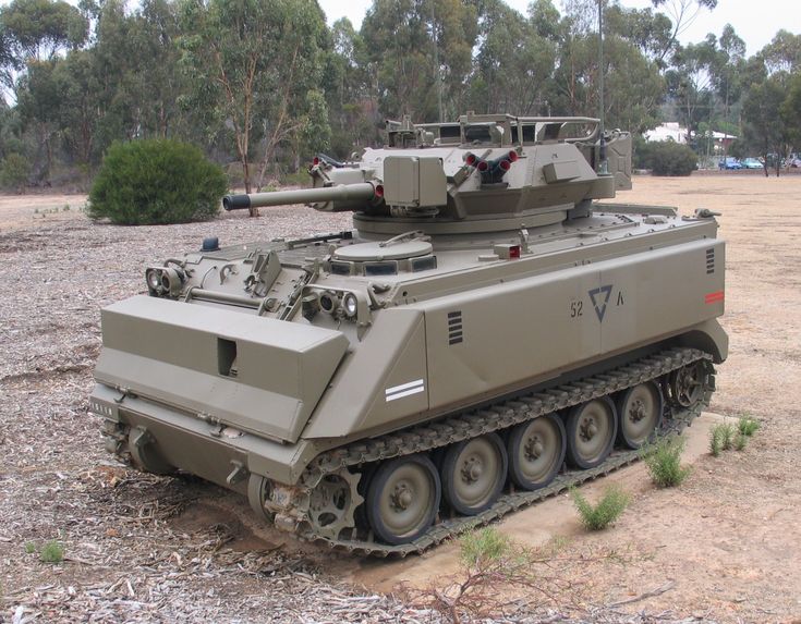 an army tank sitting on top of a dirt field