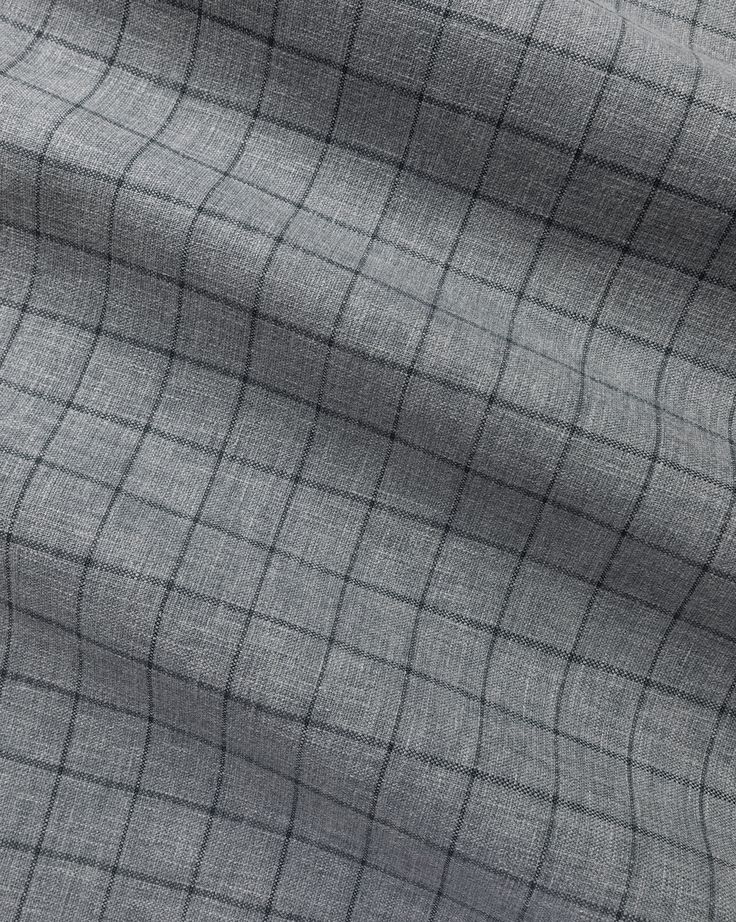 grey fabric with small squares and lines on the top, as well as an image of a