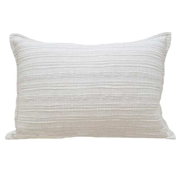 a white pillow that is on a white background with no one in the photo to describe it