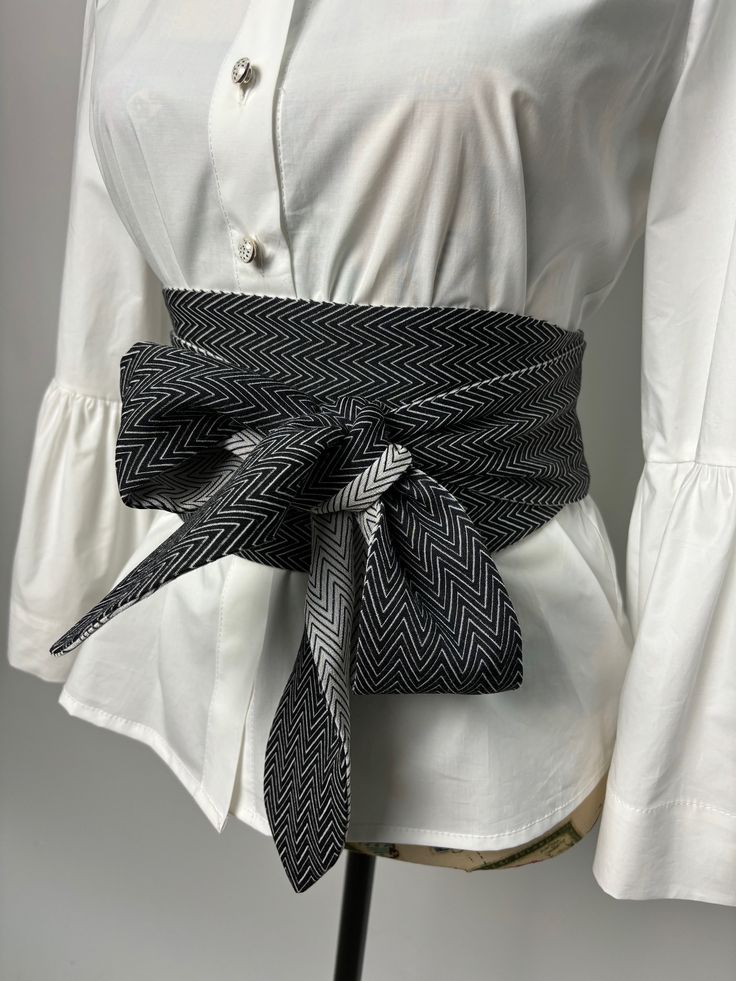 Double sided wide belt in black and black with white. The belt is suitable for long and medium length shirts, dresses and tunics. Goes great with a skirt or pants. It is made in several sizes. Size is determined by waist circumference. A great addition to your look. We produce quality garments for sustainable fashion.  Join our audience for special discounts with promo codes.  Copy the link below into your browser and confirm your subscription from the email you will receive.  https://mailchi.mp Black Fabric Belt For Summer, Spring Black Belted Corset Belt, White Fabric Belt For Summer, Black Corset Belt For Spring, Chic Black Belts For Spring, Cloth Belt, Belt For Women, Obi Belt, Wrap Belt