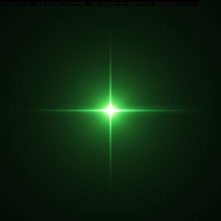 an image of a green light shining in the dark