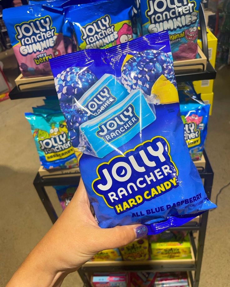 What really is the BEST flavor of Jolly Ranchers? Most people say it is Blue Raspberry! And if you agree then you're in for a treat! We just stocked up on Jolly Rancher Hard Candy bags that are ONLY Blue Raspberry! Shop our Jolly Rancher collection in-store on online at www.sweetvintagetees.com #JollyRancher #BlueRaspberry #JollyRancherBlueRaspberry #hardcandy #newarrival Blue Jolly Ranchers, Candy American, Jolly Rancher Lollipops, 90s Candy, Jolly Rancher Hard Candy, Jolly Ranchers, Kitty Accessories, Sleepover Food, Junk Food Snacks