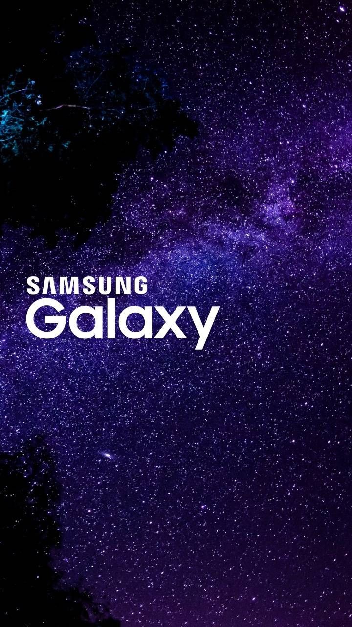 the samsung galaxy logo is shown against a night sky with stars and trees in the background