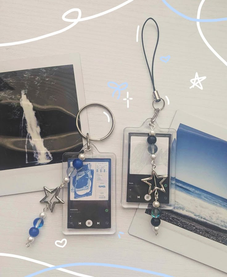 some pictures and charms are hanging on a table