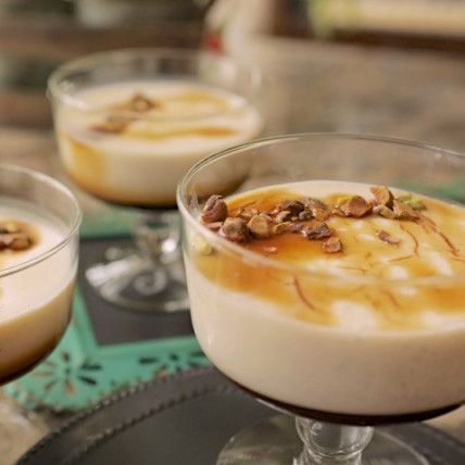 two desserts in glasses on a table