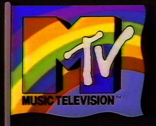 the tv logo for music television, with a rainbow in the background and a cross on it